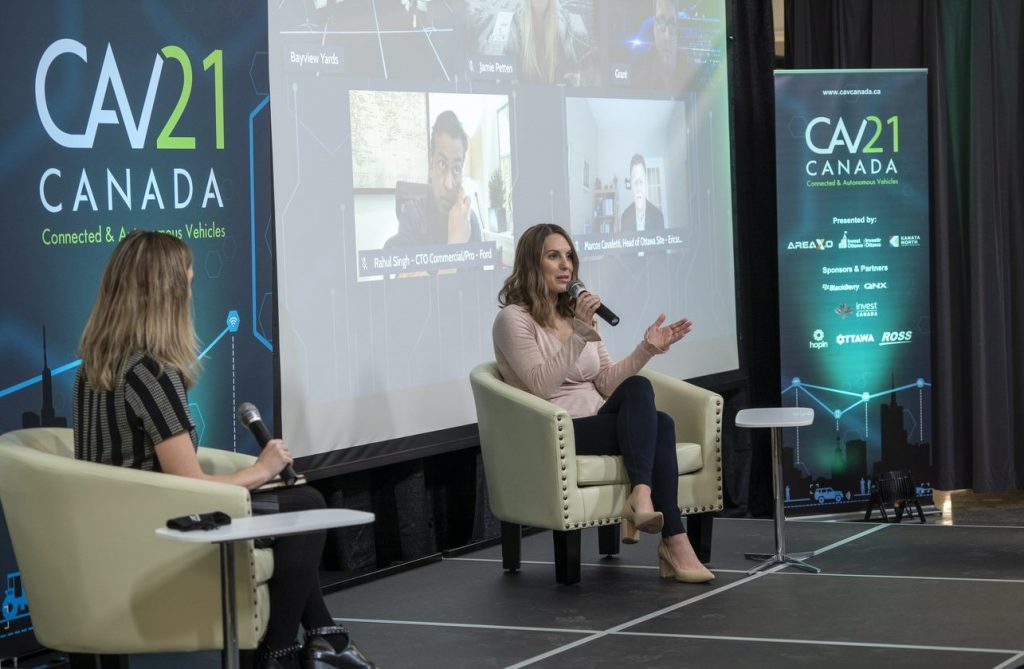 Image of the CAV Canada stage with speaker, Tenille Houston of Autoguardian and Natalie MacArthur at Invest Ottawa